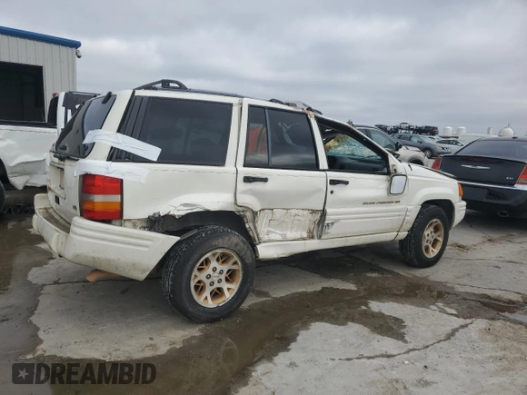1997 Jeep Grand Cherokee Limited with VIN 1J4GX78YXVC716353, listed as a Copart auction lot 85207974 with 115,527 mi miles and Salvage Title. Bid and sale history available at carsss.com. Image 3.