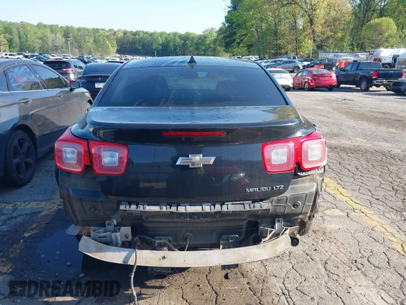 2014 Chevrolet Malibu LTZ with VIN 1G11H5SL9EF123813, listed as a IAAI auction lot 41984575 with 204,536 mi miles and . Bid and sale history available at DreamBid. Image 16.
