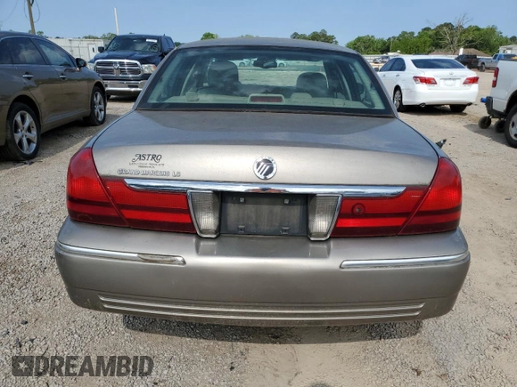 2005 Mercury Grand Marquis LS Premium z VIN 2MEFM75W65X609038, wystawiony jako Copart lot #55766005 z przebiegiem 132 136 mil mil oraz Szkoda całkowita • Salvage title. Historia ofert i sprzedaży dostępna na DreamBid. Obrazek 6.