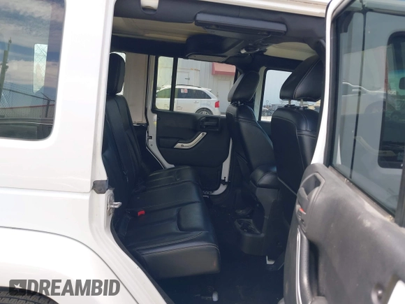 2015 Jeep Wrangler Unlimited Rubicon z VIN 1C4BJWFG1FL544883, wystawiony jako IAAI lot #42838891 z przebiegiem 87 801 mil mil oraz . Historia ofert i sprzedaży dostępna na DreamBid. Obrazek 8.