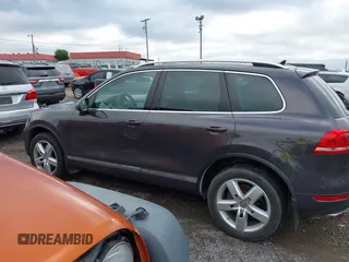 2012 Volkswagen Touareg Sport with VIN WVGFK9BP0CD002939, listed as a IAAI auction lot 42531654 with 222,435 mi miles and . Bid and sale history available at DreamBid. Image 14.