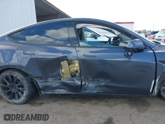 2022 Tesla Model Y Long Range with VIN 7SAYGAEE6NF341827, listed as a IAAI auction lot 41946388 with Not Provided miles and . Bid and sale history available at DreamBid. Image 12.