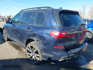 2021 BMW X7 M50i with VIN 5UXCX6C0XM9E15417, listed as a IAAI auction lot 41402910 with 70,768 mi miles. Bid and sale history available at carsss.com. Image 3.