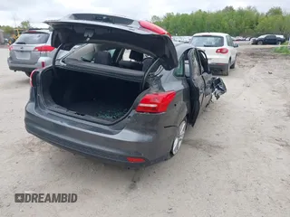 2016 Ford Focus SE z VIN 1FADP3F22GL327604, wystawiony jako IAAI lot #42319889 z przebiegiem 97 736 mil mil oraz . Historia ofert i sprzedaży dostępna na DreamBid. Obrazek 4.
