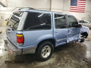 1997 Ford Explorer XLT with VIN 1FMDU35P8VZB98855, listed as a Copart auction lot 44594105 with 210,155 mi miles and Salvage title. Bid and sale history available at DreamBid. Image 3.