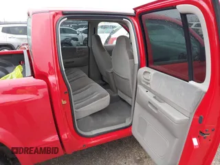 2004 Dodge Dakota Sport with VIN 1D7HL38KX4S657177, listed as a IAAI auction lot 41534575 with 38,802 mi miles. Bid and sale history available at carsss.com. Image 8.
