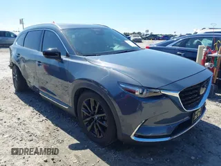 2021 Mazda CX-9 Carbon Edition z VIN JM3TCADY9M0517174, wystawiony jako IAAI lot #41871485 z przebiegiem 48 484 mil mil oraz . Historia ofert i sprzedaży dostępna na DreamBid. Obrazek 1.