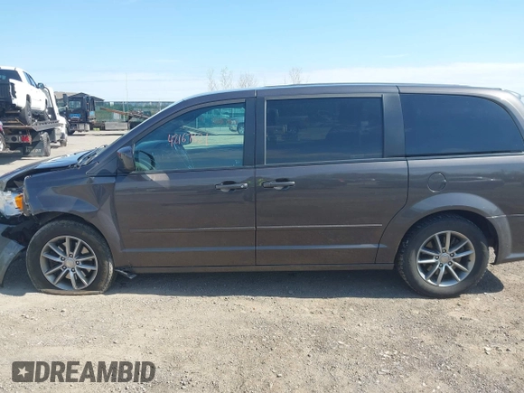 2015 Dodge Grand Caravan SE with VIN 2C4RDGBG2FR684367, listed as a IAAI auction lot 42167621 with 216,628 mi miles and . Bid and sale history available at DreamBid. Image 14.