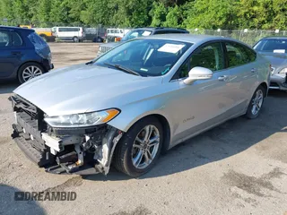 2016 Ford Fusion SE Hybrid z VIN 3FA6P0LU6GR121605, wystawiony jako IAAI lot #42651096 z przebiegiem 194 693 mil mil oraz . Historia ofert i sprzedaży dostępna na DreamBid. Obrazek 2.