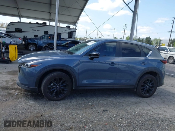 2023 Mazda CX-5 S Carbon Edition z VIN JM3KFBCM5P0179543, wystawiony jako IAAI lot #41950082 z przebiegiem 31 573 mil mil oraz . Historia ofert i sprzedaży dostępna na DreamBid. Obrazek 15.