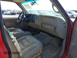1999 GMC Suburban with VIN 1GKFK16RXXJ809823, listed as a IAAI auction lot 41687406 with 360,799 mi miles. Bid and sale history available at carsss.com. Image 5.