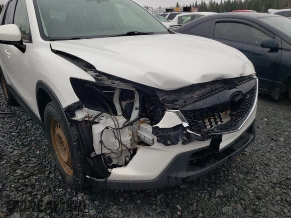 2014 Mazda CX-5 Touring z VIN JM3KE4CY1E0406726, wystawiony jako Copart lot #54652065 z przebiegiem 245 491 mil mil oraz Szkoda całkowita • Salvage title. Historia ofert i sprzedaży dostępna na DreamBid. Obrazek 13.