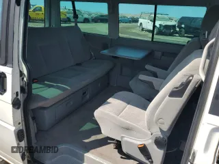 2003 Volkswagen EuroVan MV с VIN WV2MB47033H038192, выставлен на аукционе Copart как лот 67783954 с пробегом 176 595 миль миль и Списание • Salvage title. История ставок и продаж доступна на DreamBid. Изображение 11.