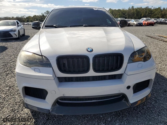 2011 BMW X6 M with VIN 5YMGZ0C55BLK13899, listed as a Copart auction lot 77141774 with 93,316 mi miles and Salvage Title. Bid and sale history available at carsss.com. Image 5.