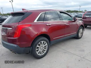 2017 Cadillac XT5 FWD with VIN 1GYKNARS2HZ107587, listed as a IAAI auction lot 41614842 with 124,611 mi miles and . Bid and sale history available at carsss.com. Image 4.