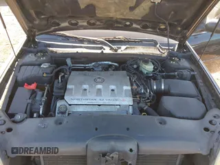 2002 Cadillac DeVille DTS with VIN 1G6KF57992U219921, listed as a IAAI auction lot 41261360 with 127,710 mi miles. Bid and sale history available at carsss.com. Image 10.