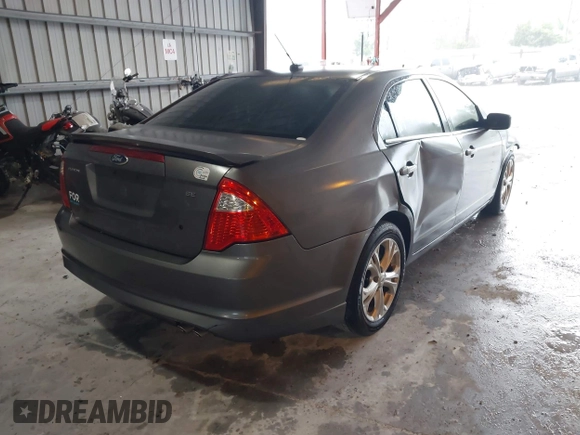 2012 Ford Fusion SE z VIN 3FAHP0HA9CR325249, wystawiony jako IAAI lot #41803339 z przebiegiem 203 650 mil mil oraz . Historia ofert i sprzedaży dostępna na DreamBid. Obrazek 4.