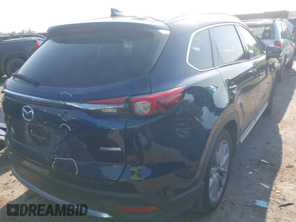 2020 Mazda CX-9 Grand Touring with VIN JM3TCADY0L0422548, listed as a IAAI auction lot 41839601 with 116,952 mi miles and . Bid and sale history available at DreamBid. Image 4.
