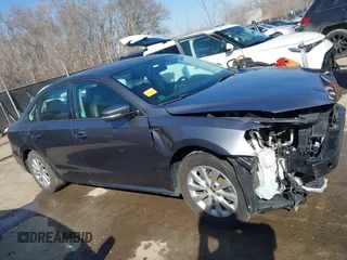 2015 Volkswagen Passat 1.8T Limited Edition with VIN 1VWAT7A33FC015366, listed as a IAAI auction lot 41769888 with 129,117 mi miles. Bid and sale history available at carsss.com. Image 14.