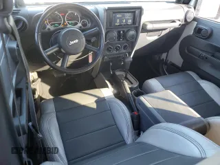 2007 Jeep Wrangler Unlimited Sahara with VIN 1J4GB59197L144781, listed as a Copart auction lot 48678315 with 137,538 mi miles and Salvage title. Bid and sale history available at DreamBid. Image 8.