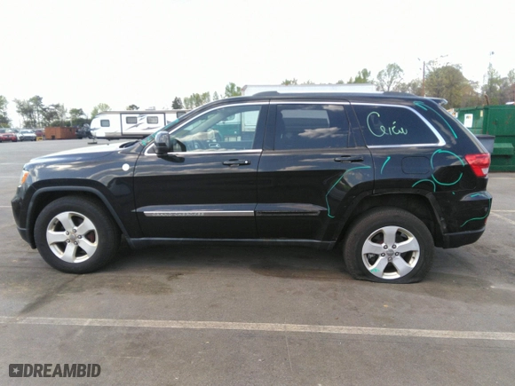 2011 Jeep Grand Cherokee Laredo with VIN 1J4RR4GTXBC538060, listed as a IAAI auction lot 41964694 with 152,999 mi miles. Bid and sale history available at carsss.com. Image 15.