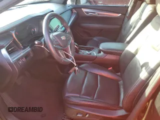 2022 Cadillac XT5 FWD Luxury z VIN 1GYKNAR49NZ159814, wystawiony jako Copart lot #74506584 z przebiegiem 7 069 mil mil oraz Nie do naprawy • Non repairable. Historia ofert i sprzedaży dostępna na DreamBid. Obrazek 7.