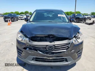 2016 Mazda CX-5 Sport z VIN JM3KE2BY3G0886115, wystawiony jako Copart lot #53803325 z przebiegiem Nie podano mil oraz Szkoda całkowita • Salvage title. Historia ofert i sprzedaży dostępna na DreamBid. Obrazek 5.