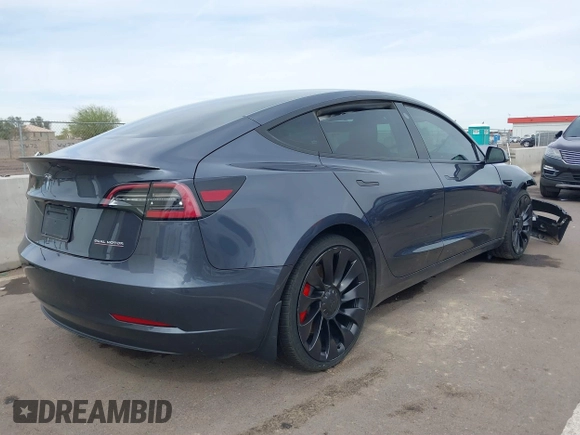 2022 Tesla Model 3 Performance with VIN 5YJ3E1EC3NF296891, listed as a IAAI auction lot 41808329 with 82,682 mi miles and . Bid and sale history available at DreamBid. Image 4.