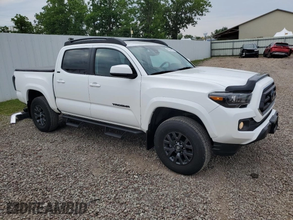 2023 Toyota Tacoma SR with VIN 3TMCZ5AN2PM642205, listed as a Copart auction lot 61045955 with 10,596 mi miles and Salvage title. Bid and sale history available at DreamBid. Image 4.