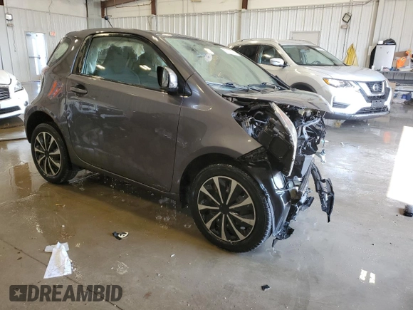 2012 Scion iQ with VIN JTNJJXB07CJ018013, listed as a Copart auction lot 57101085 with 91,370 mi miles and Non repairable. Bid and sale history available at DreamBid. Image 4.