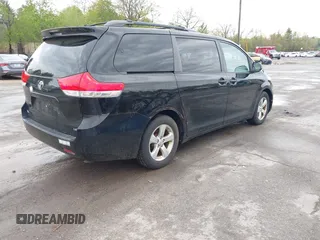 2014 Toyota Sienna LE AAS with VIN 5TDKK3DC0ES487830, listed as a IAAI auction lot 42216342 with 155,973 mi miles and . Bid and sale history available at carsss.com. Image 4.