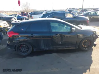 2015 Ford Focus ST with VIN 1FADP3L95FL339181, listed as a IAAI auction lot 41397051 with 124,656 mi miles. Bid and sale history available at carsss.com. Image 14.