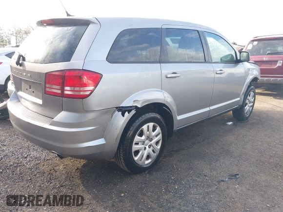2015 Dodge Journey SE z VIN 3C4PDCAB3FT641675, wystawiony jako IAAI lot #41898611 z przebiegiem 218 121 mil mil oraz . Historia ofert i sprzedaży dostępna na DreamBid. Obrazek 4.