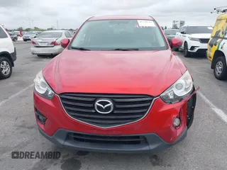 2016 Mazda CX-5 Touring with VIN JM3KE2CY3G0877185, listed as a IAAI auction lot 41729243 with 144,656 mi miles. Bid and sale history available at carsss.com. Image 12.