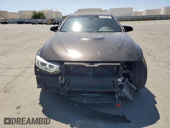 2015 BMW M4 with VIN WBS3R9C50FK333819, listed as a Copart auction lot 61105565 with 168,932 mi miles and Salvage title. Bid and sale history available at DreamBid. Image 5.