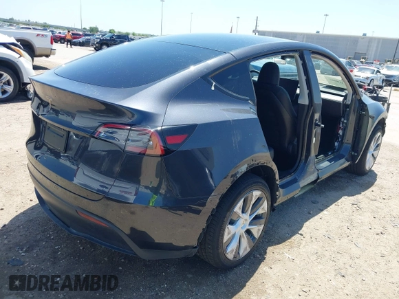 2024 Tesla Model Y with VIN 7SAYGDED2RF040745, listed as a IAAI auction lot 41986613 with 9,778 mi miles and . Bid and sale history available at DreamBid. Image 4.