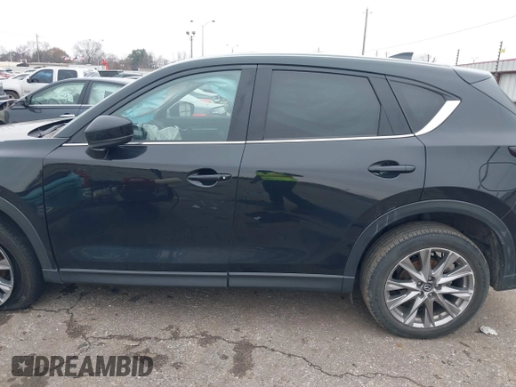 2020 Mazda CX-5 Grand Touring with VIN JM3KFADM8L0811910, listed as a IAAI auction lot 41446214 with 57,849 mi miles. Bid and sale history available at carsss.com. Image 15.