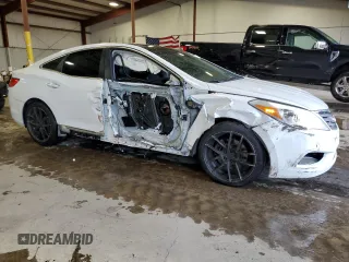 2013 Hyundai Azera z VIN KMHFH4JG0DA225049, wystawiony jako Copart lot #65530604 z przebiegiem 77 218 mil mil oraz Szkoda całkowita • Salvage title. Historia ofert i sprzedaży dostępna na DreamBid. Obrazek 4.