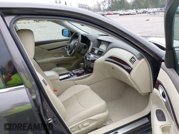 2015 Infiniti Q70 with VIN JN1BY1ARXFM562111, listed as a IAAI auction lot 42473521 with 123,212 mi miles and . Bid and sale history available at DreamBid. Image 5.