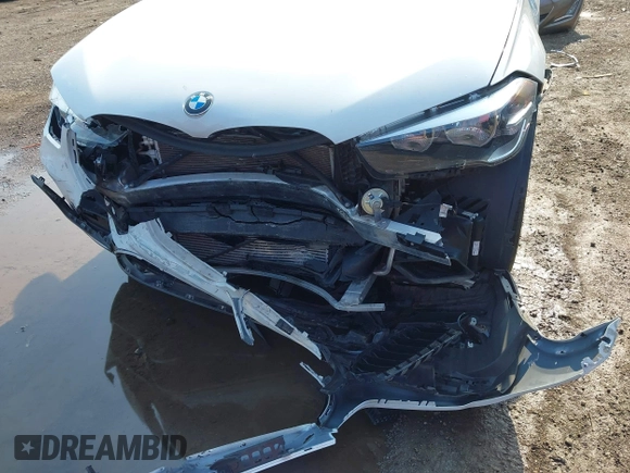 2021 BMW X1 xDrive28i with VIN WBXJG9C02M3M42379, listed as a IAAI auction lot 42476221 with 60,412 mi miles and . Bid and sale history available at DreamBid. Image 6.