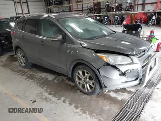 2014 Ford Escape Titanium with VIN 1FMCU9J90EUC31625, listed as a IAAI auction lot 41492075 with 301,917 mi miles and . Bid and sale history available at DreamBid. Image 1.