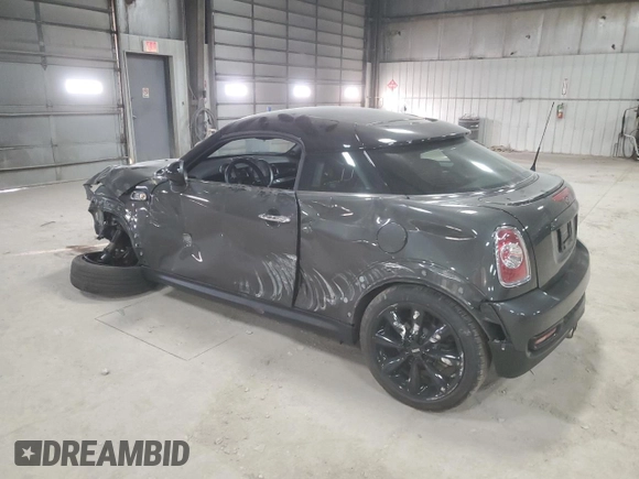 2012 MINI Coupe S z VIN WMWSX3C51CT408195, wystawiony jako Copart lot #77008744 z przebiegiem Nie podano mil oraz Szkody całkowita. Historia ofert i sprzedaży dostępna na DreamBid. Obrazek 2.