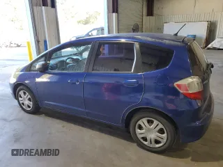2009 Honda Fit with VIN JHMGE88279S059230, listed as a Copart auction lot 81409304 with 140,991 mi miles and Clean Title. Bid and sale history available at carsss.com. Image 2.