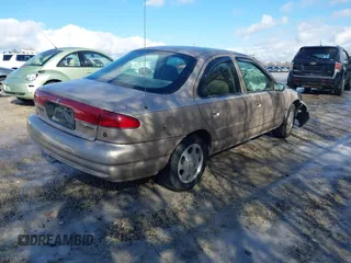 1999 Mercury Mystique GS z VIN 1MEFM6530XK635463, wystawiony jako IAAI lot #41478903 z przebiegiem 87 911 mil mil oraz . Historia ofert i sprzedaży dostępna na DreamBid. Obrazek 4.
