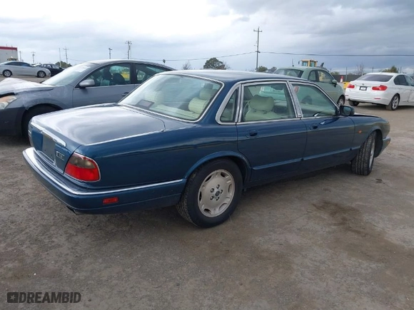 1996 Jaguar XJ Series Sedan with VIN SAJHX1743TC759842, listed as a IAAI auction lot 41778155 with NaN miles. Bid and sale history available at carsss.com. Image 4.