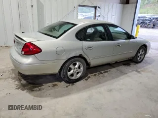 2003 Ford Taurus SE Standard z VIN 1FAFP532X3A195612, wystawiony jako Copart lot #54016645 z przebiegiem 143 168 mil mil oraz Szkoda całkowita • Salvage title. Historia ofert i sprzedaży dostępna na DreamBid. Obrazek 3.