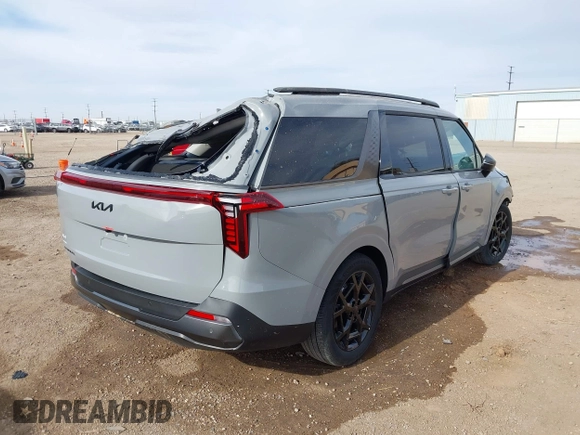 2025 Kia Carnival SX with VIN KNDNE5K33S6497315, listed as a IAAI auction lot 41133179 with 3,063 mi miles and . Bid and sale history available at DreamBid. Image 4.