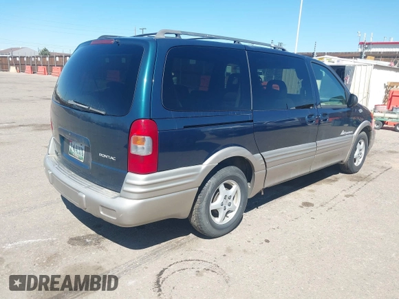 1999 Pontiac Montana with VIN 1GMDX03E0XD166084, listed as a IAAI auction lot 41872976 with 196,027 mi miles and . Bid and sale history available at DreamBid. Image 4.