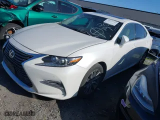 2016 Lexus ES 300h Hybrid with VIN JTHBW1GG0G2101603, listed as a IAAI auction lot 41677725 with 148,182 mi miles. Bid and sale history available at carsss.com. Image 2.