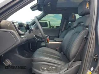 2022 Rivian R1S Launch Edition z VIN 7PDSGABL5NN001018, wystawiony jako Copart lot #56914725 z przebiegiem 26 156 mil mil oraz Szkoda całkowita • Salvage title. Historia ofert i sprzedaży dostępna na DreamBid. Obrazek 7.